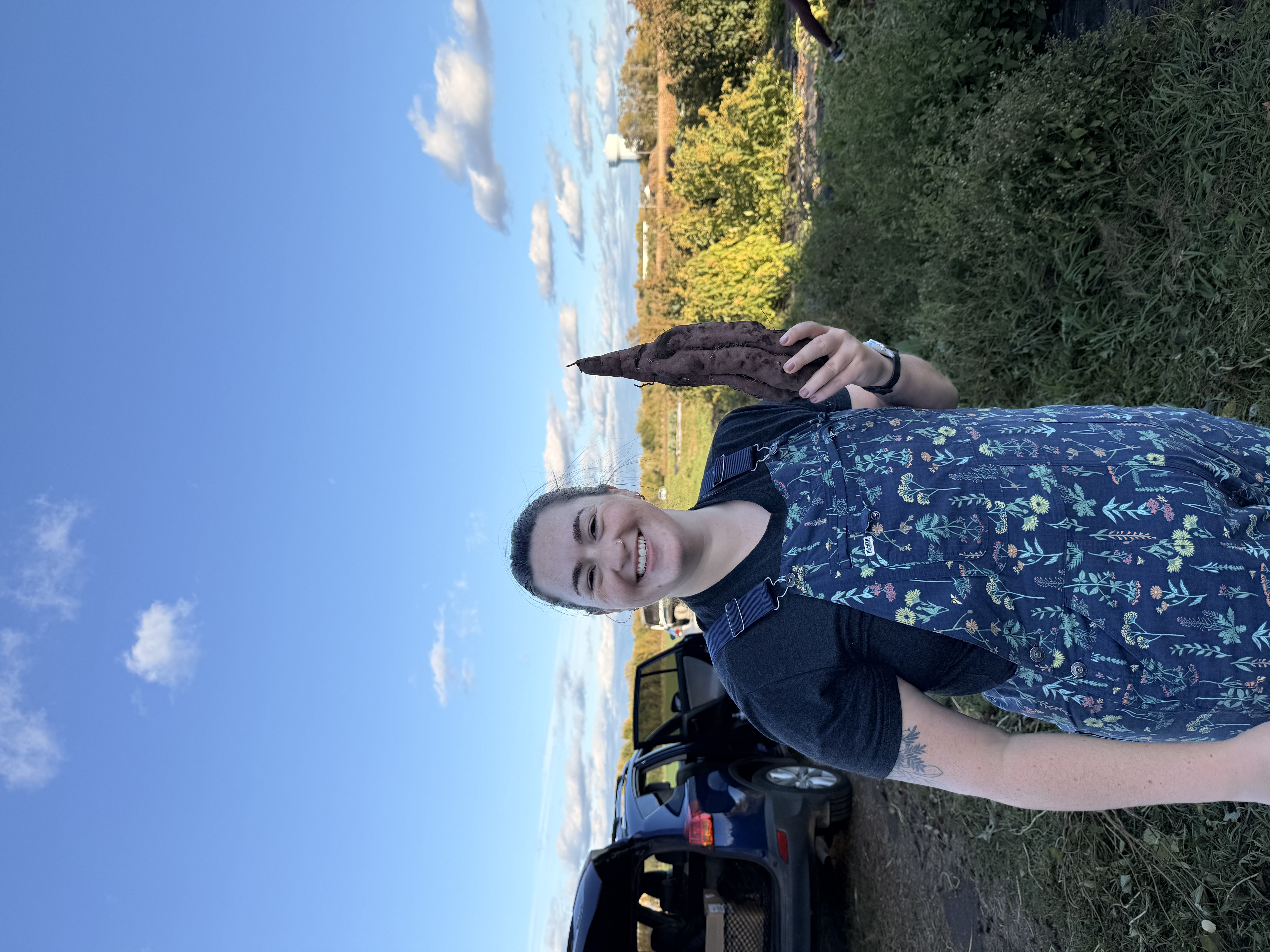 Person smiling with sweet potato
